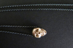 Gold skull pendant