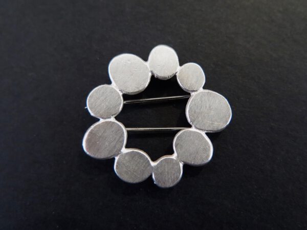 Pressed circles brooch